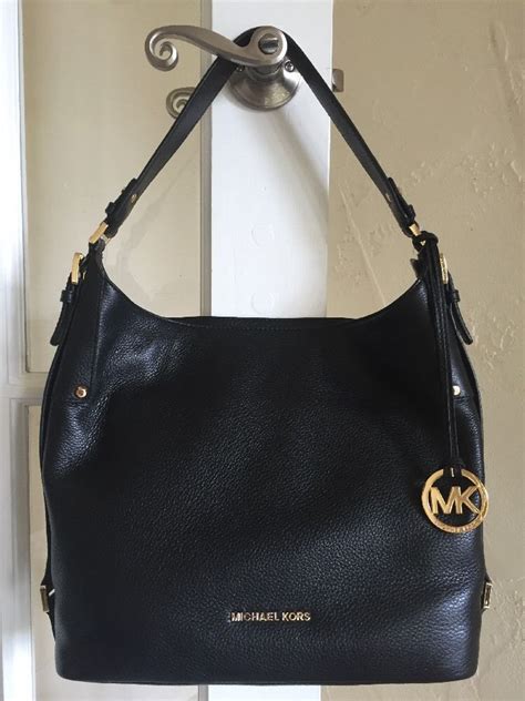 michael kors belted leather purse|Michael Kors black backpack purse.